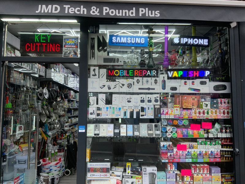 JMD Tech & Pound Plus store front with Samsung and iPhone displays